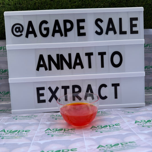 Agape Sale Annatto Extract' text and a glass of red liquid on a branded surface.